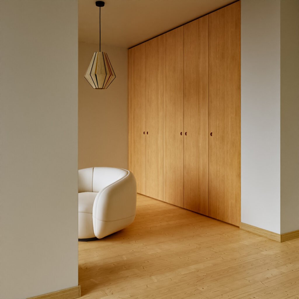 a room with a white chair and wooden doors